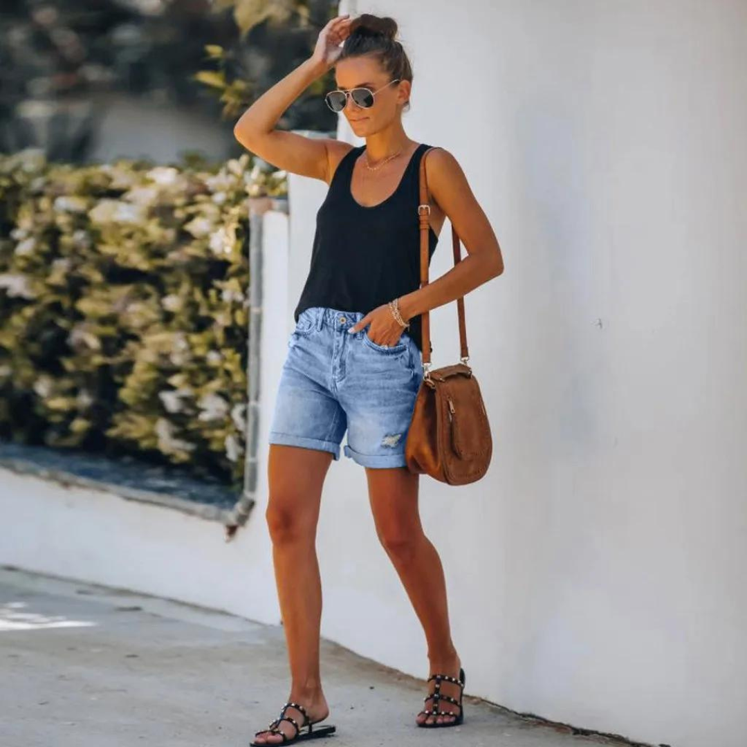 Högmidjade jeansshorts med insliten look - Molly