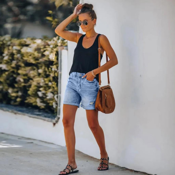 Högmidjade jeansshorts med insliten look - Molly
